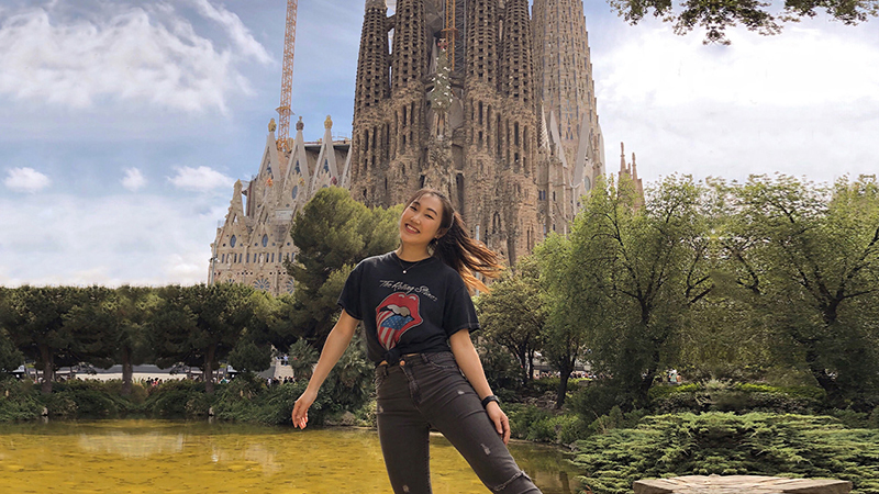 Student in front of monument on international trip